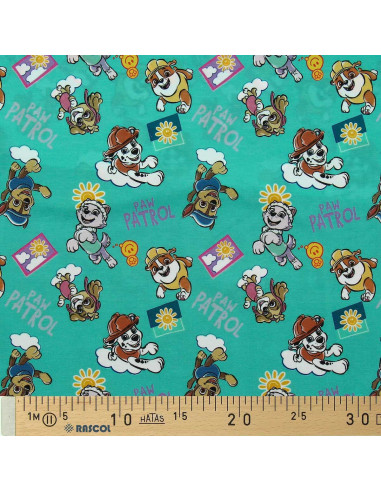 Tessuto jersey Paw Patrol - Sole su sfondo blu turchese